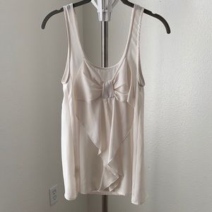 Cream tank with bow detail on back